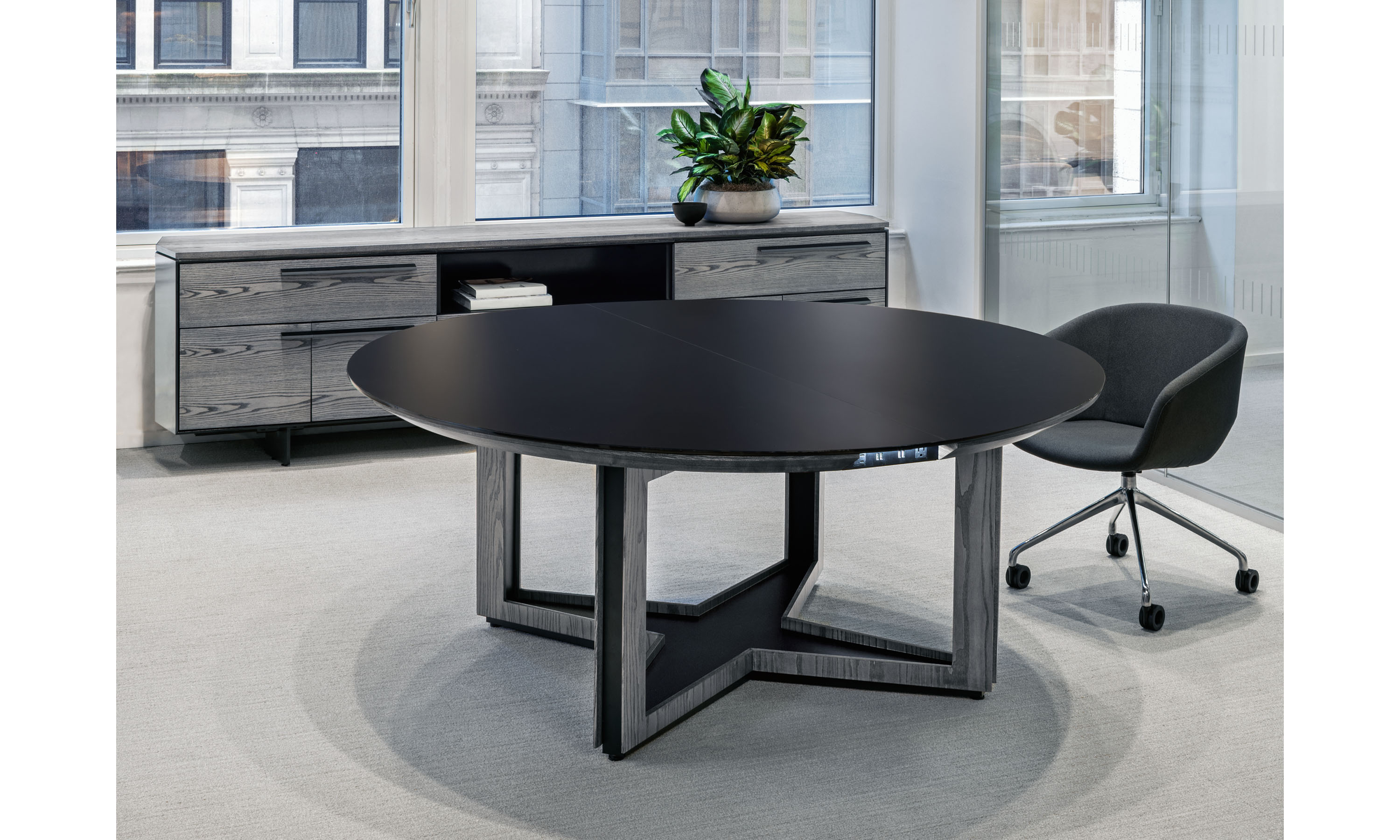 Ascari_Conference_Table_and_Credenza_Round_Glass_Top_with_Open_Panel_X_Base_NYC_Showroom_2023v2.jpg feature slideshow image 2