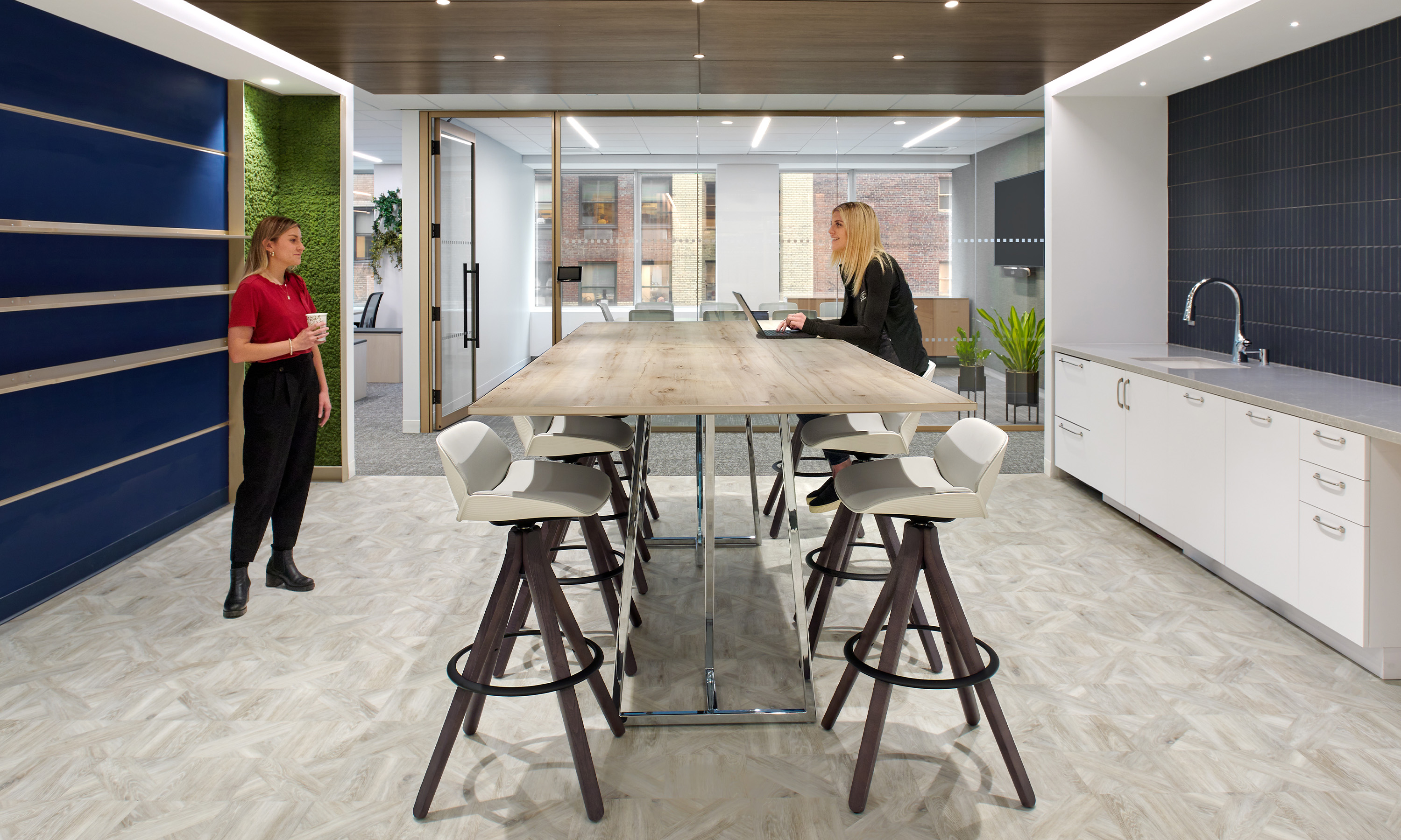 Standing height Nucraft table in BBR Partners cafe area. Space designed by M. Moser. by Aaron Thompson