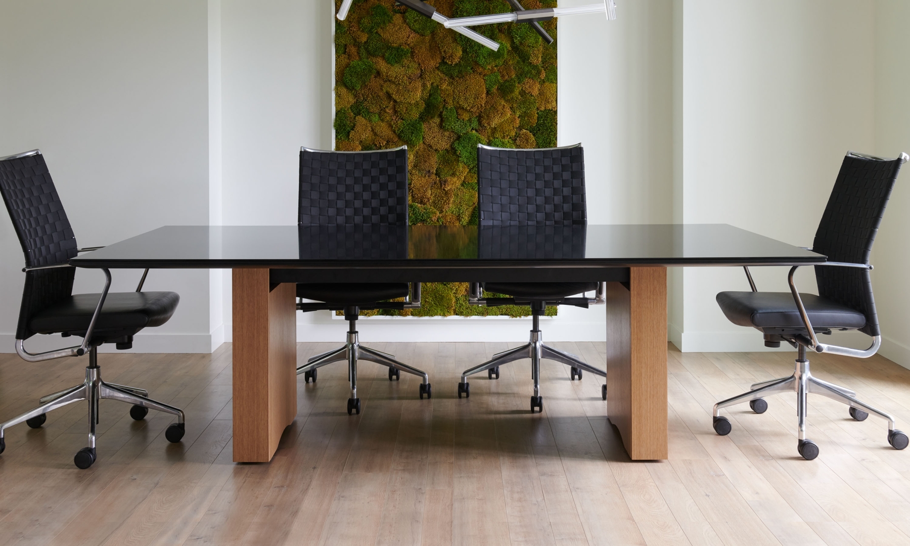 Flow conference table with Black glass top and veneer base