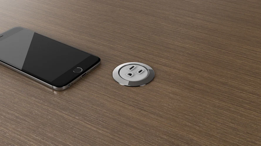 <p>This compact unit allows for the addition of power to a work surface in a discreet way. </p>