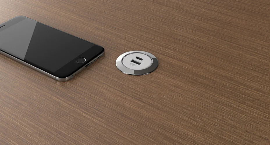 <p>This compact unit allows for the addition of power to a work surface in a discreet way. </p>